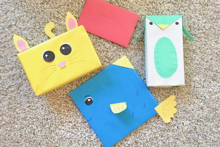 Tips voor het creatief inpakken van cadeau’s Cadeau's creatief ingepakt als een kat, vis en pinguin